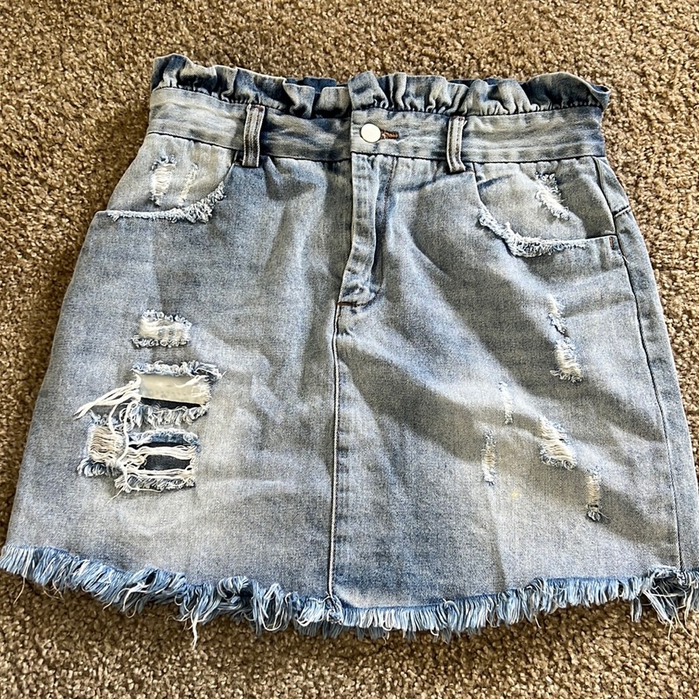 Cute denim skirt with holes in front and back!